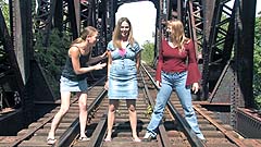 Georgia, Mela, and Vicktoria wetting on a train track