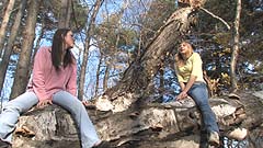 Vicktoria and Mela climb a falled tree trunk