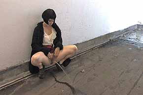 girl peeing on wooden floor